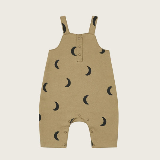 Beige baby romper with black moon pattern on a beige background