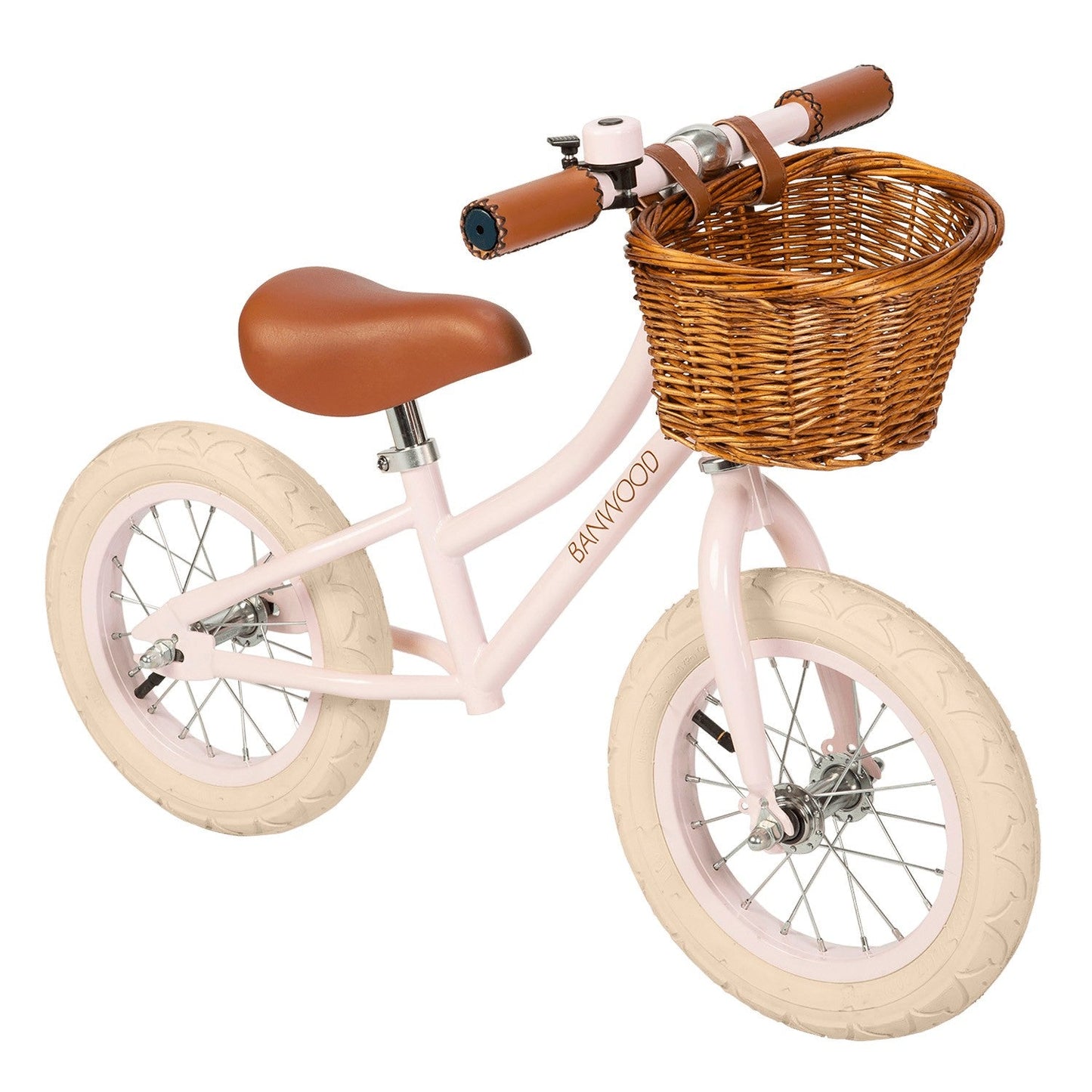 Pink children's bicycle with a wicker basket on a white background