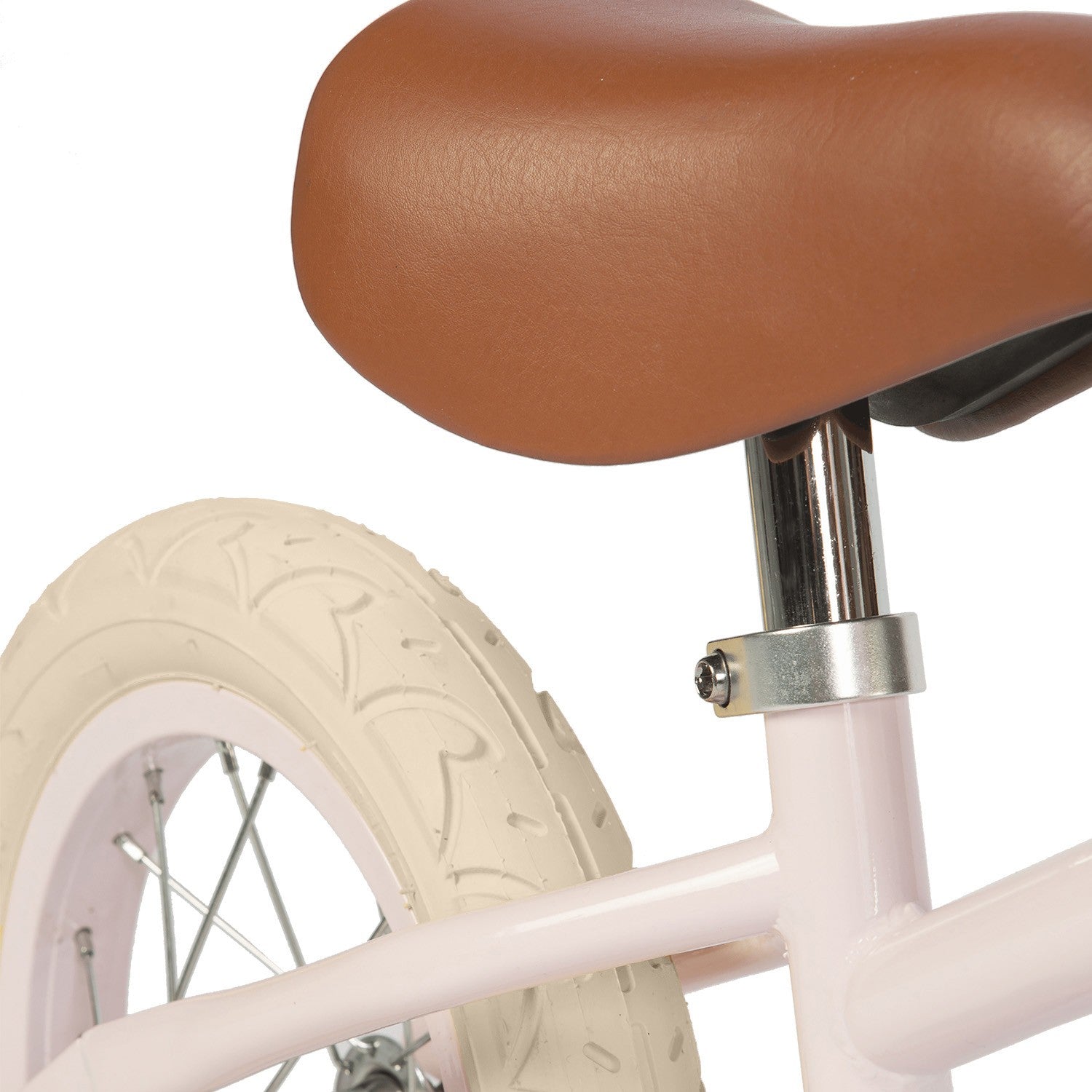 Close-up of a bicycle seat and wheel on a white background