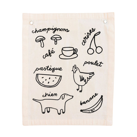 Beige towel with black line art illustrations and text on a white background