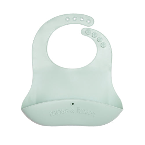 Mint green silicone bib with 'moss & town' branding on a white background
