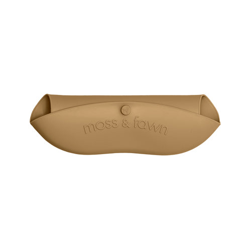 Tan pet bed with 'moss & fawn' branding on a white background