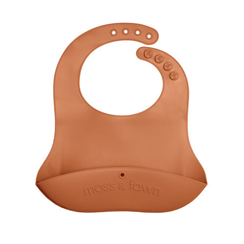 Brown silicone bib with 'moss & fawn' branding on a white background