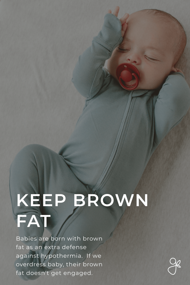 Baby in a light blue onesie with a red pacifier, lying on a neutral background.