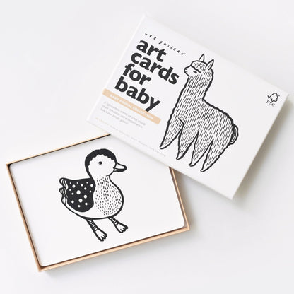 Box of art cards for baby with illustrations of a duck and a llama on a white background