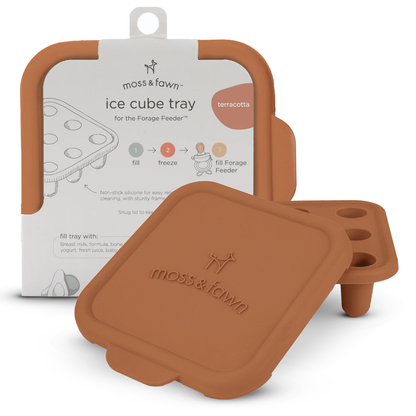Terracotta-colored ice cube tray with packaging on a white background