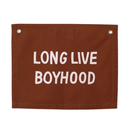 Brown banner with 'LONG LIVE BOYHOOD' text on a white background