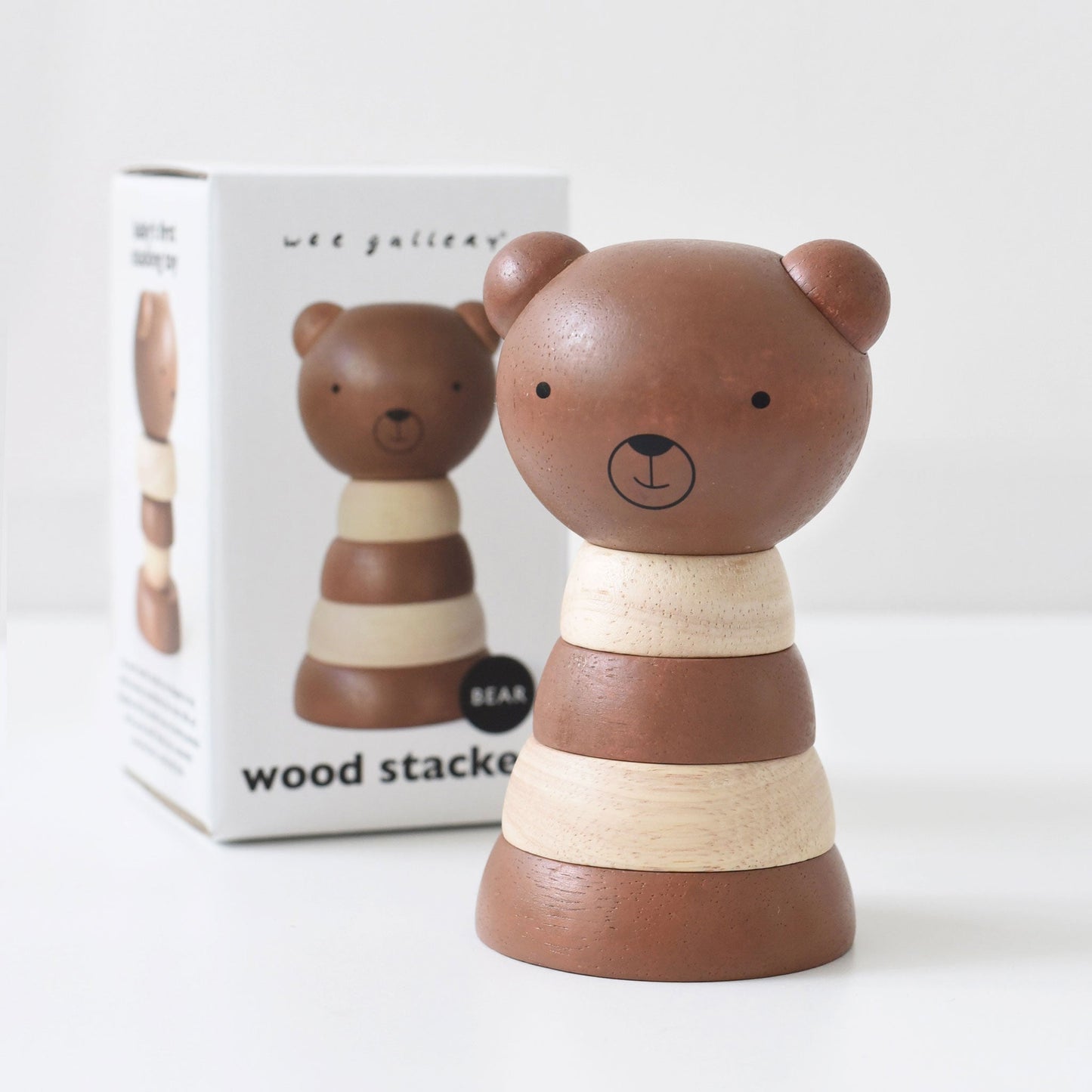 Wooden bear stacker toy with packaging on a white background