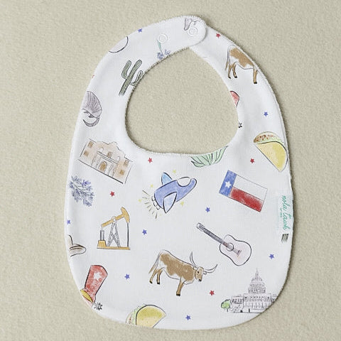 Baby bib with colorful patterns on a beige background