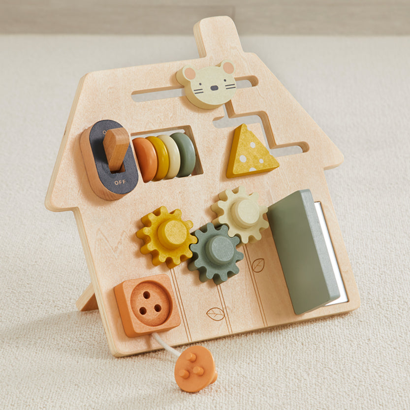 Wooden toy with various shapes and a mouse figure on a beige background