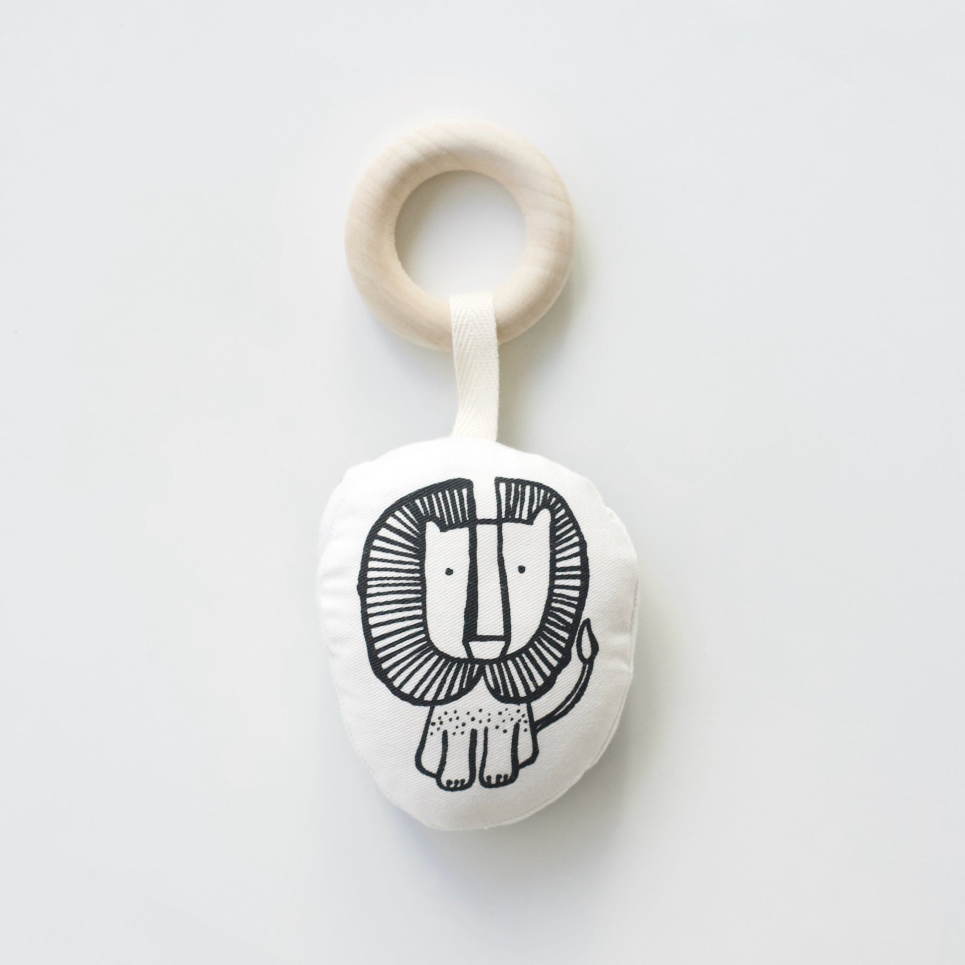 Teething ring with lion design on a white background