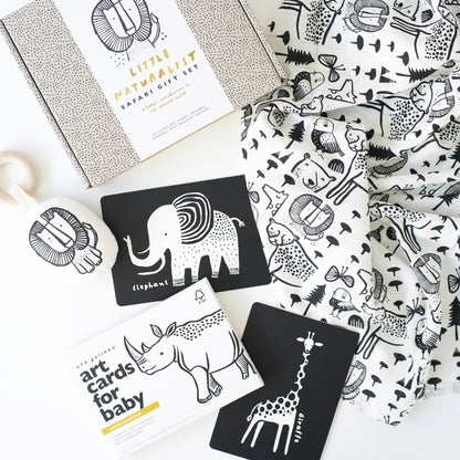 Collection of art cards with animal illustrations and a patterned fabric on a white surface.