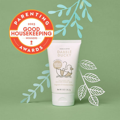 Tube of Dabble Ducky baby product with Good Housekeeping Award badge on green background