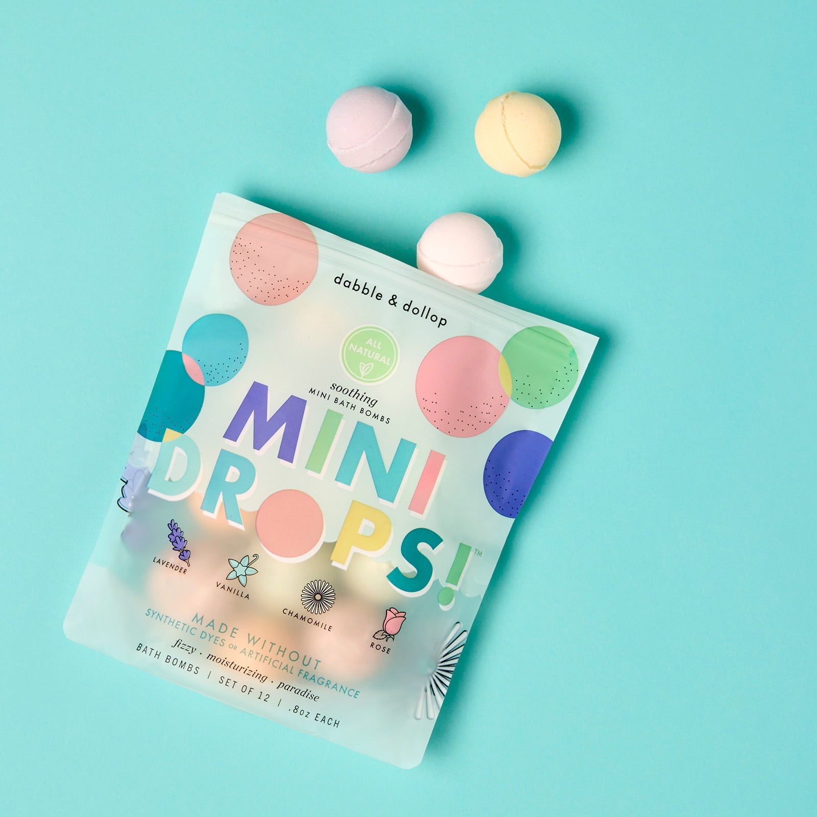 Dabble & Dallop Mini Drops packaging with bath bombs on a light blue background