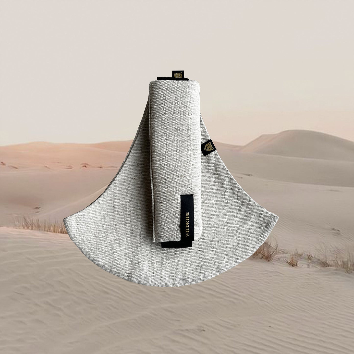 Toddler carrier with brand logo on a desert background