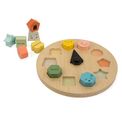 Wooden shape sorting toy with colorful shapes on a white background