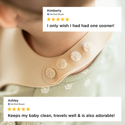 Baby bib with customer reviews displayed on a light background