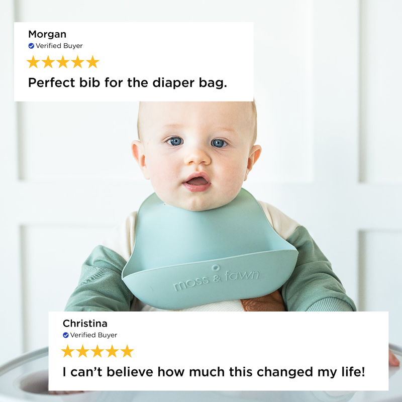 Baby wearing a green bib with positive reviews displayed above