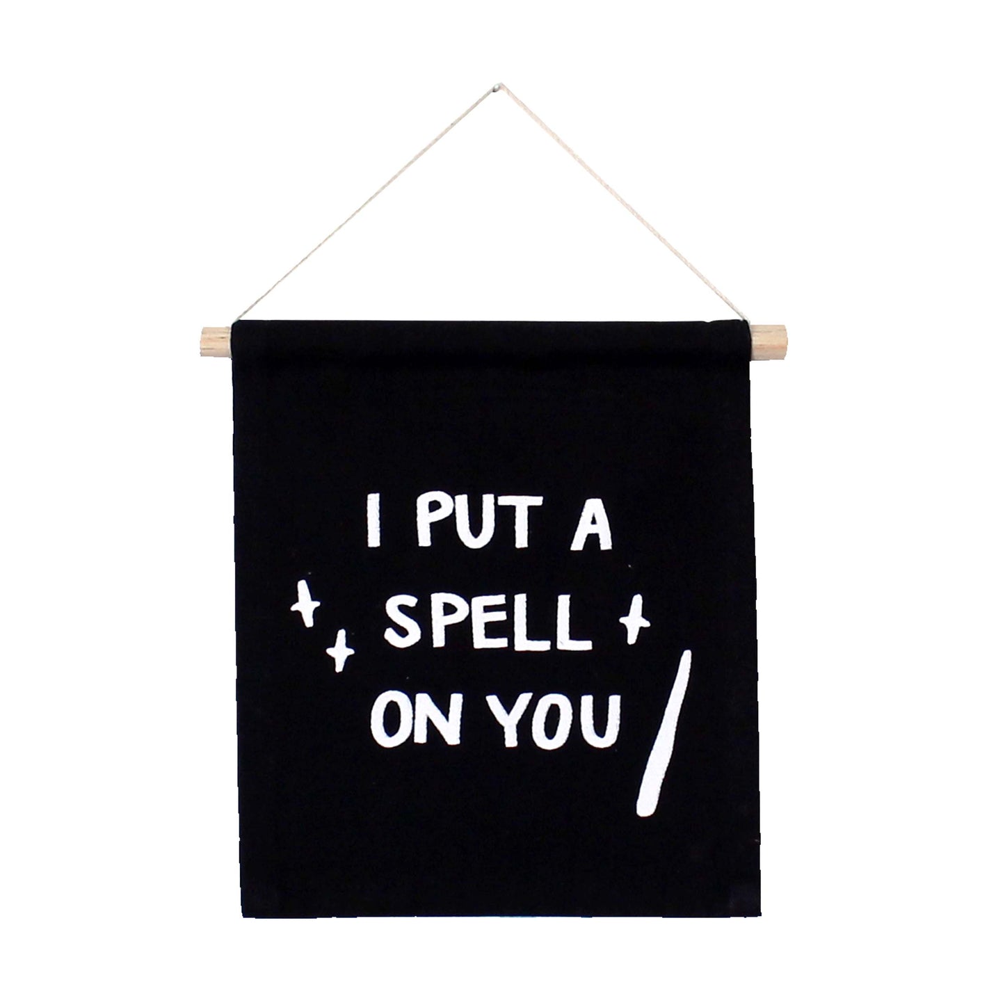 Black banner with white text 'I PUT A SPELL ON YOU' hanging on a white background