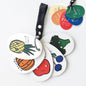 Colorful fruit-themed stroller cards on a white background