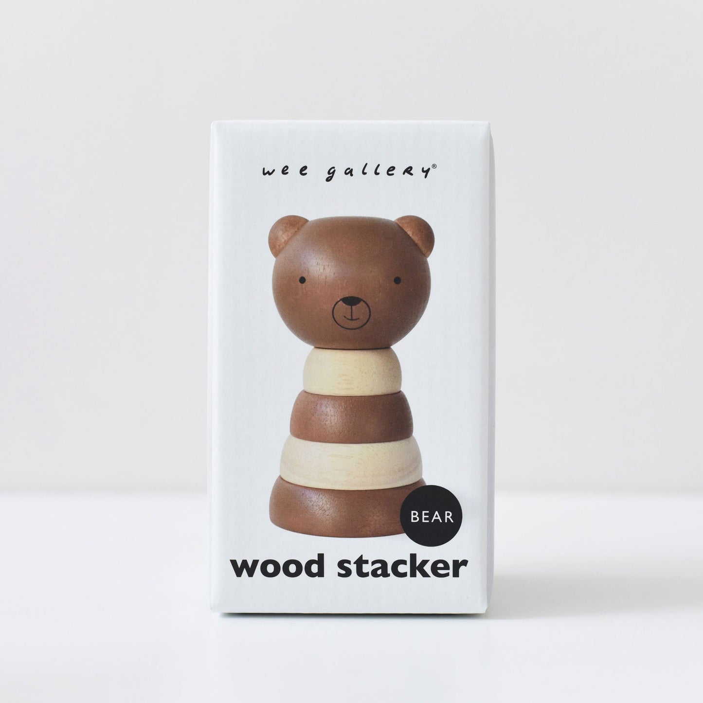 Wee Gallery wood stacker toy packaging with a bear design on a white background