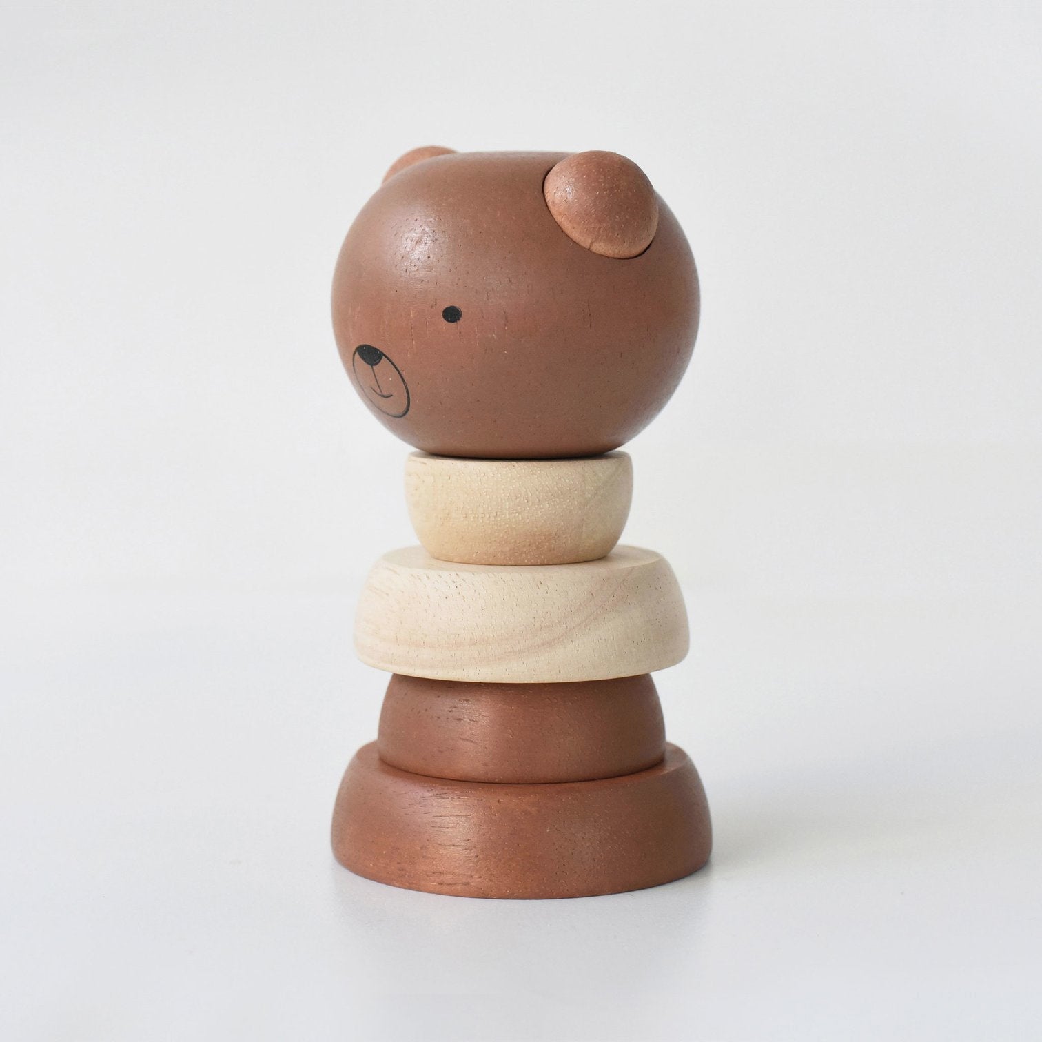 Wooden toy stacker with bear design on a white background