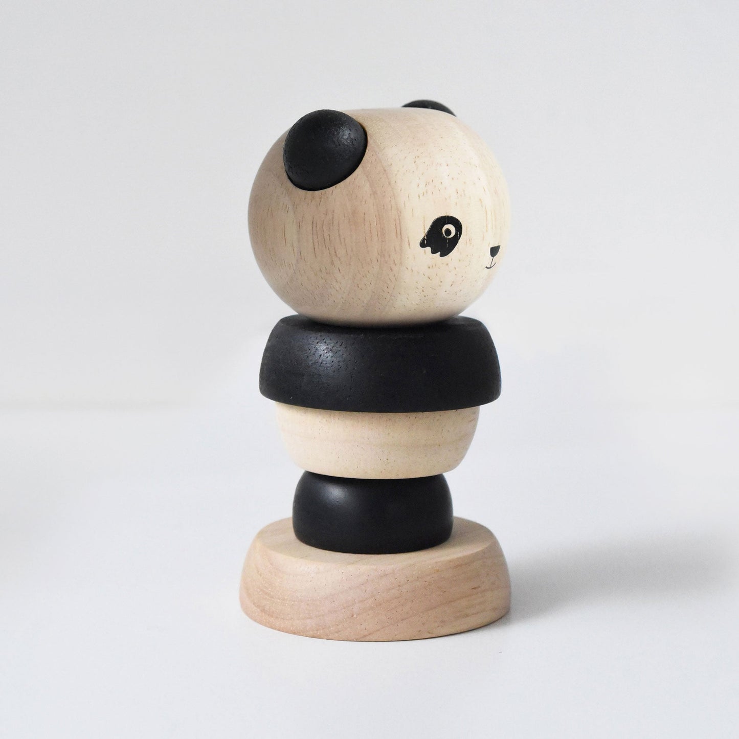 Wooden panda-shaped toy on a white background