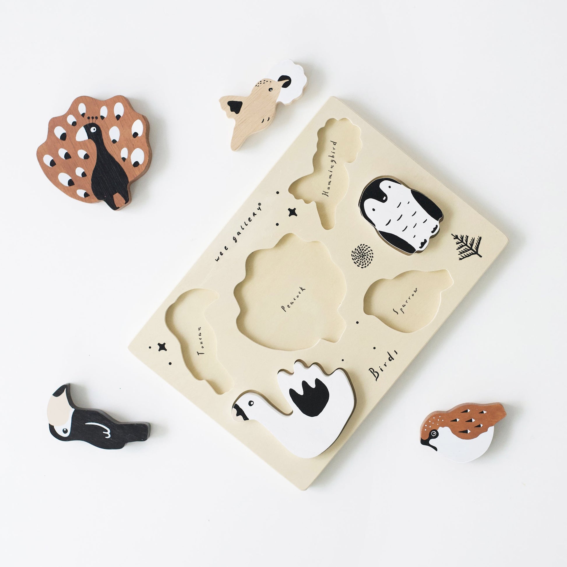 Wooden animal puzzle with pieces on a white background