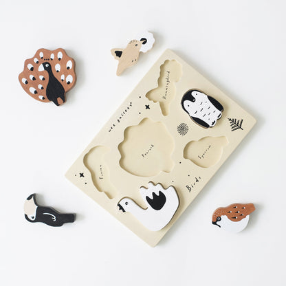 Wooden animal puzzle with pieces on a white background