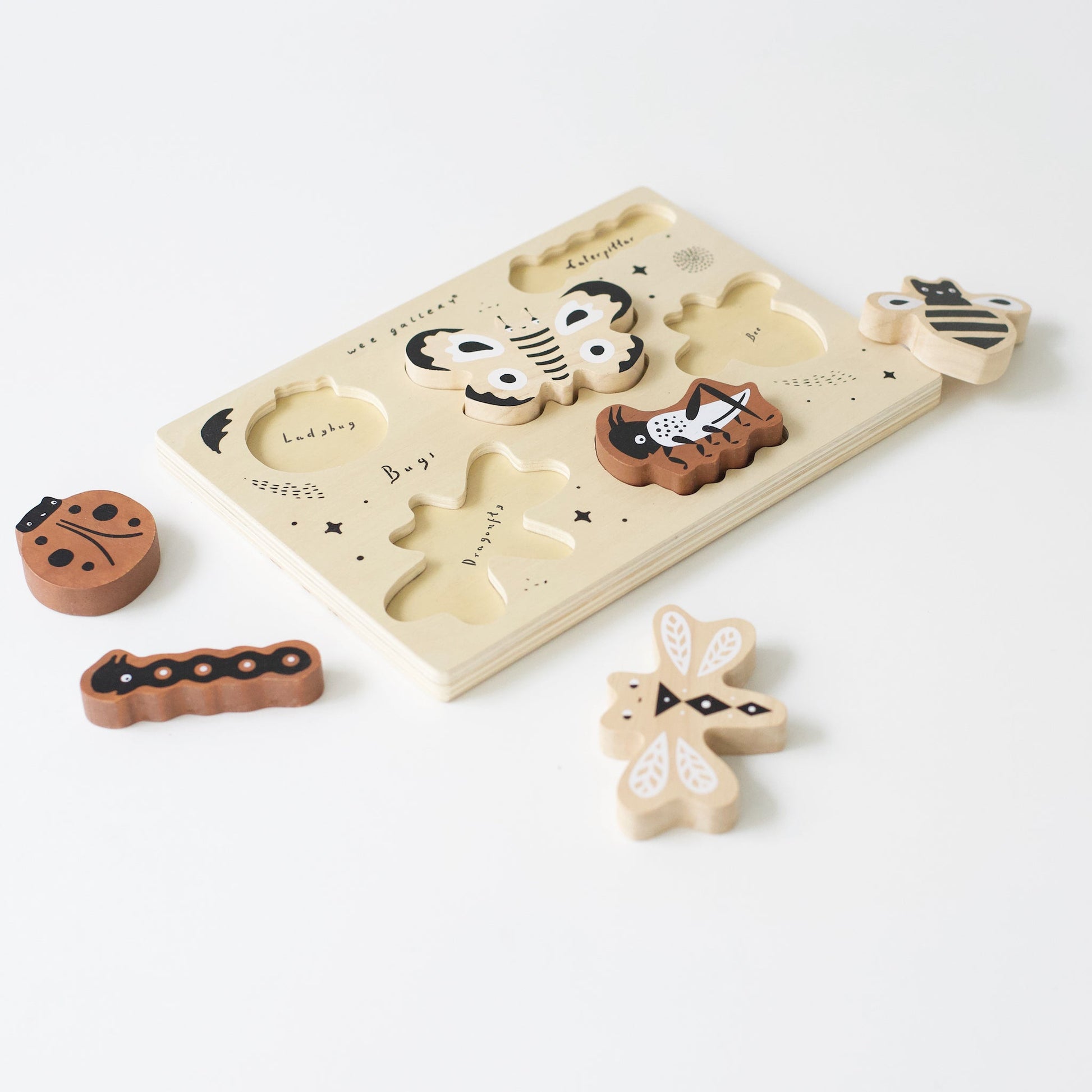 Wooden animal puzzle with pieces on a white background