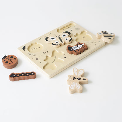 Wooden animal puzzle with pieces on a white background